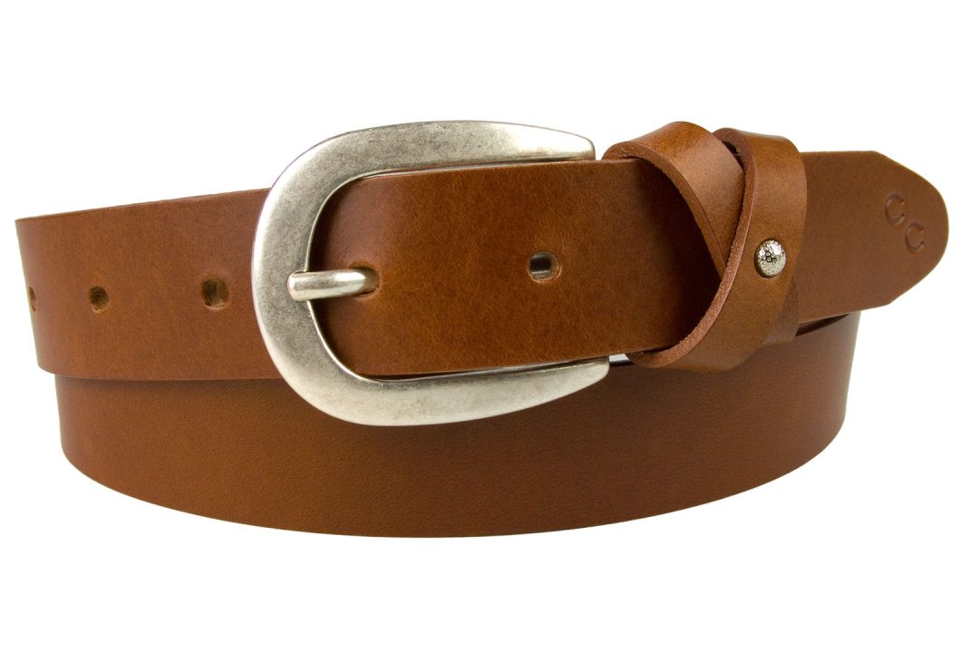 Tan Leather Belt With Feminine Crisscross Keeper. Silver Plated Buckle with an Antique finish which is lacquered for protection. The crisscross keeper has a subtle small domed embellishment to the center and the belt tip has our Champion Chase motif creating a smart feminine belt for most occasions. Made in the UK by skilled British Artisans using high grade Italian Full Grain Vegetable Tanned Leather. The belt is 3cm wide and the leather thickness is approximately 3mm.